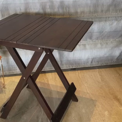 A video showing Natural Wooden Foldable Table from ebony woodcrafts being folded and moved around.